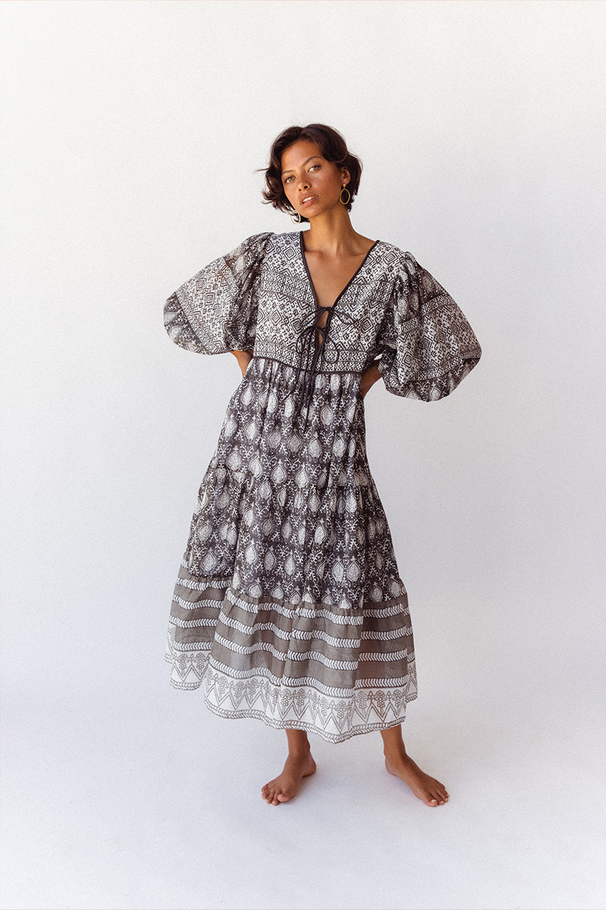 Daughters of India Jasmine Midi Dress in Charcoal — studio front view hands in pockets, hand screen print cotton