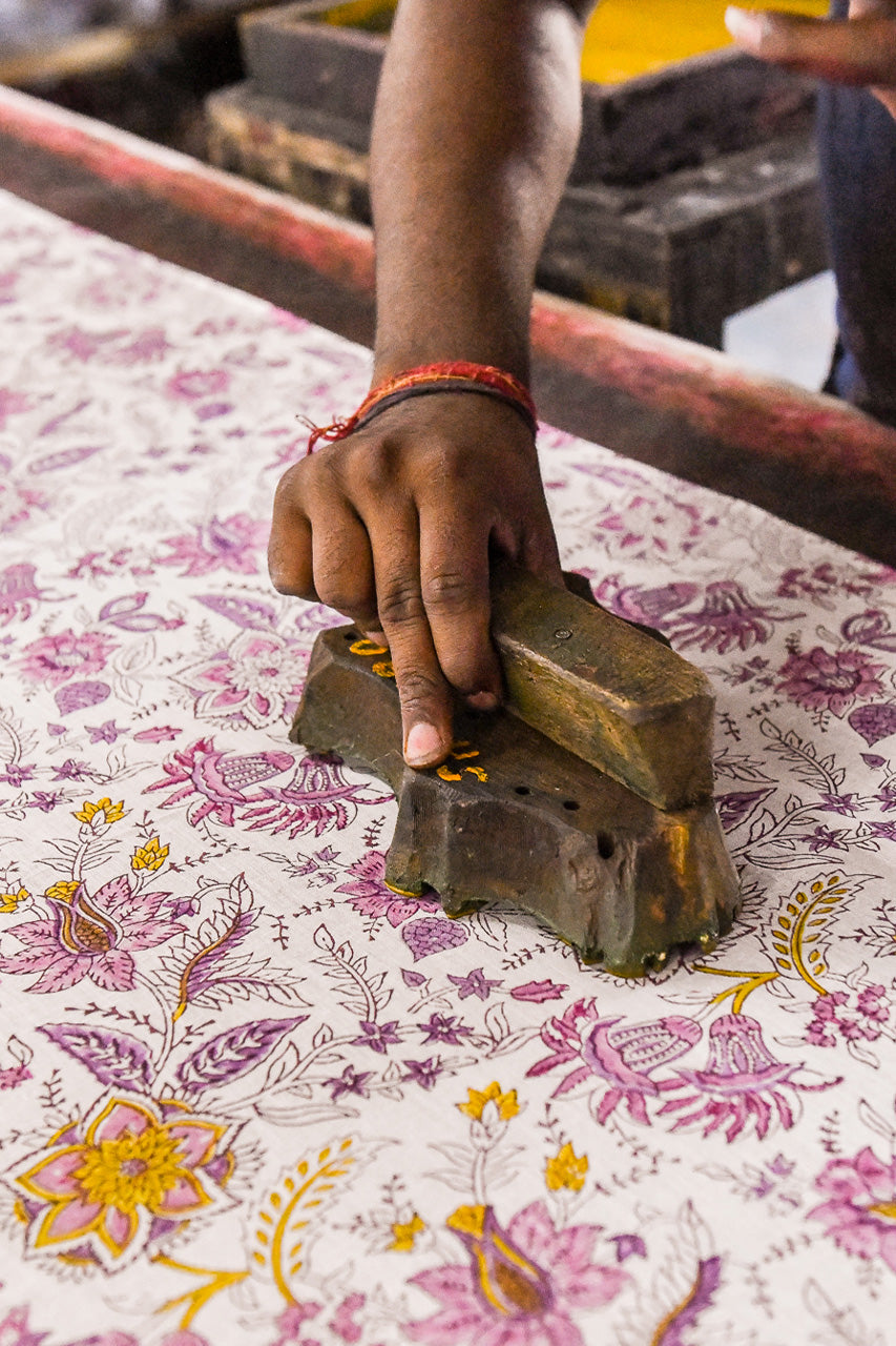 Daughters of India — Jaipur artisan hand block printing fuchsia botanical pattern onto cotton fabric
