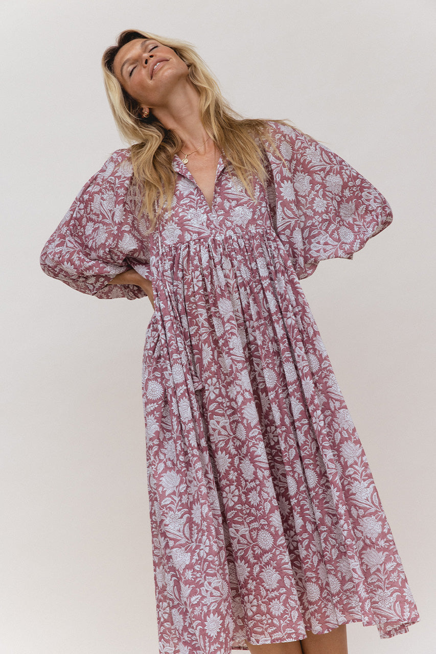 Daughters of India Kyra Midi Dress in Musk — studio V-neckline and billowed sleeves, head tilted back smiling